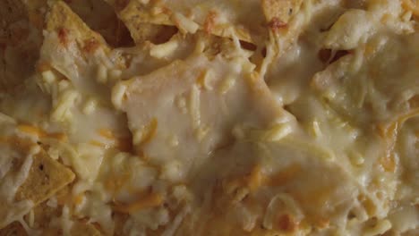 Mozzarella-cheese-melted-on-tortilla-chip-nachos,-Close-Up-Detail-Shot