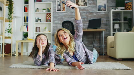 mother and daughter lying on the floor