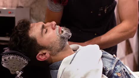 Man-getting-his-beard-shaved