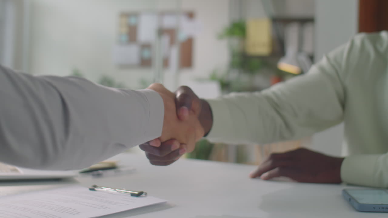 Diverse Business Partners Shaking Hands in Office
