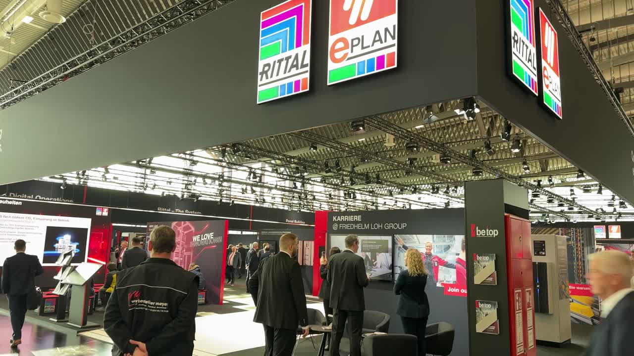 People walking around Rittal exhibition stand at the SPS Expo in Nuremberg Germany