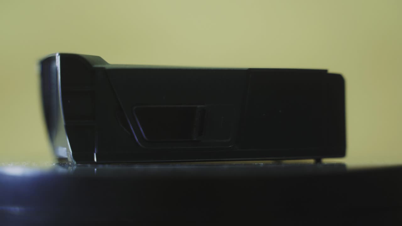 A rotating close up shot of a black lithium drone battery, mavic air, slow motion 4K
