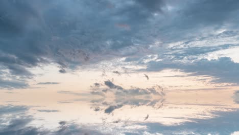 futuristic background consisting of time lapse clip of white fluffy clouds over blue sky and their reflection, video loop