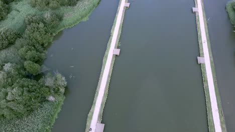 Aerial-view-of-canoeing-in-portuguese-river-in-Macieira-de-Alcoba,-Águeda