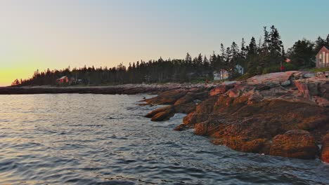 Beautiful-sunset-aerial-along-the-shoreline-of-Southport,-Maine