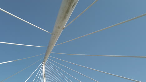 bridge cables against blue sky