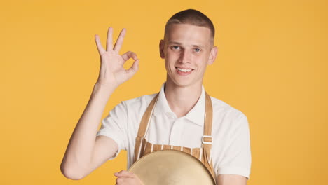 Waiter-with-blue-eyes-giving-ok-gesture