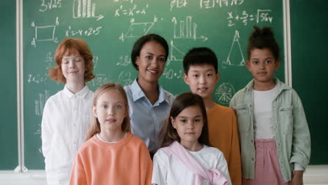 teacher and pupils posing for camera.