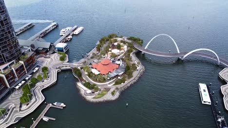 aerial view descending over the island at elizabeth quay and swan river in perth cbd