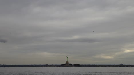 wide angle view of liberty island on cloudy evening