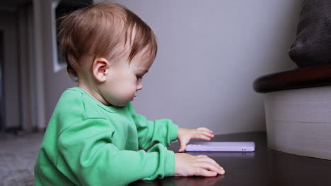 baby playing with phone