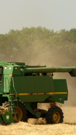 modern combine harvesting grain in the field