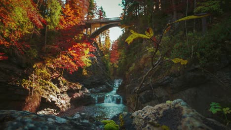 4k uhd cinemagraph - seamless video loop of a mountain river bridge canyon in the bavarian -german alps, close to the austrian border in autumn