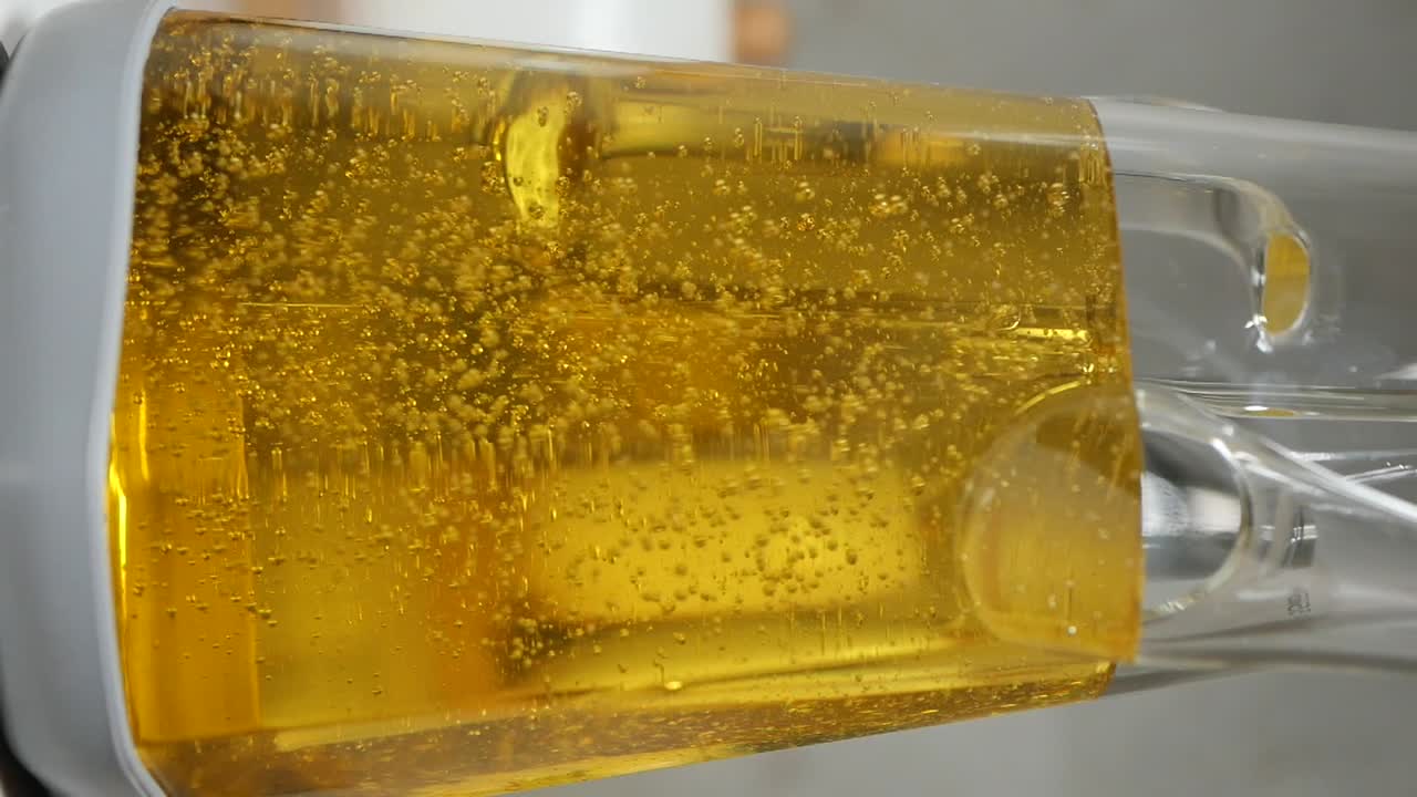 Liquid with bubbles in a transparent container