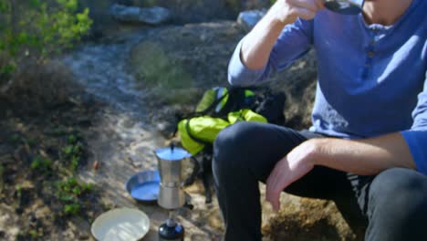 male hiker having coffee in countryside 4k