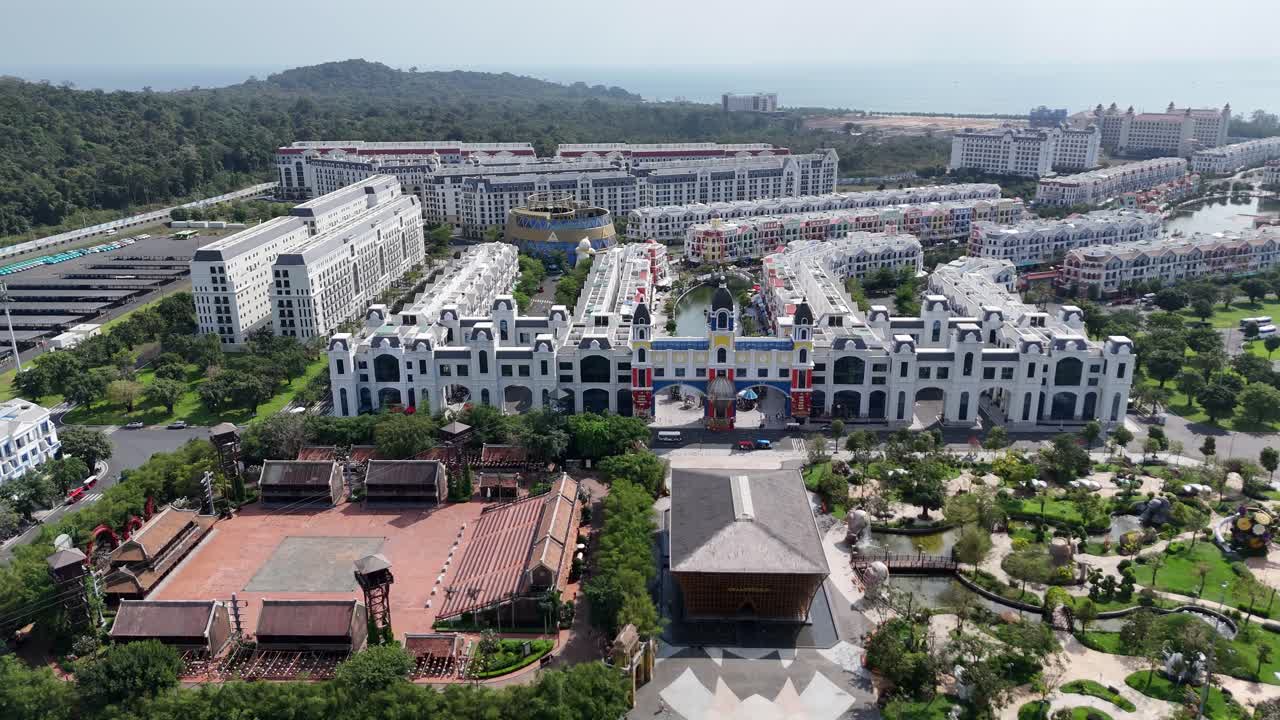 Aerial footage presents Phu Quoc Island, Vietnam, as a planned community with a distinct and unique aesthetic colorful buildings