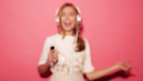 woman dancing with headphones