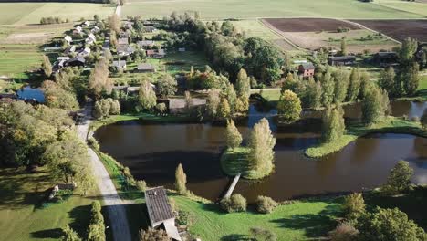 Beautiful-Rural-Countryside-Village-in-Latvia,-Eastern-Europe---Aerial,-Drone-Shot