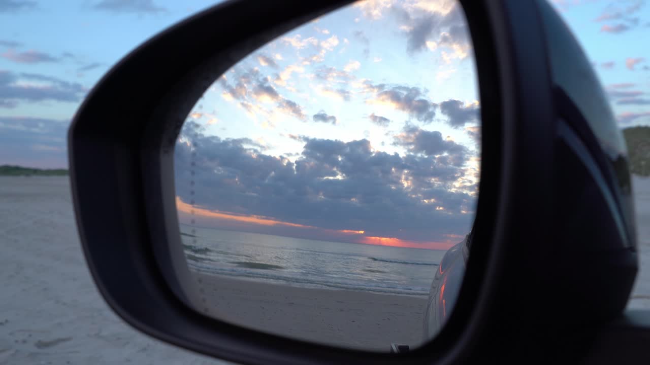 Sunset view on car mirror