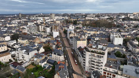 amidst gray clouds, le mans' economic pulse and historic heart shine from above.