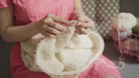 craft woman knitting wool clothes from woolen yarn. woman knitting hands