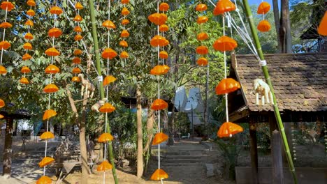 hanging orange decorations sway in the breeze