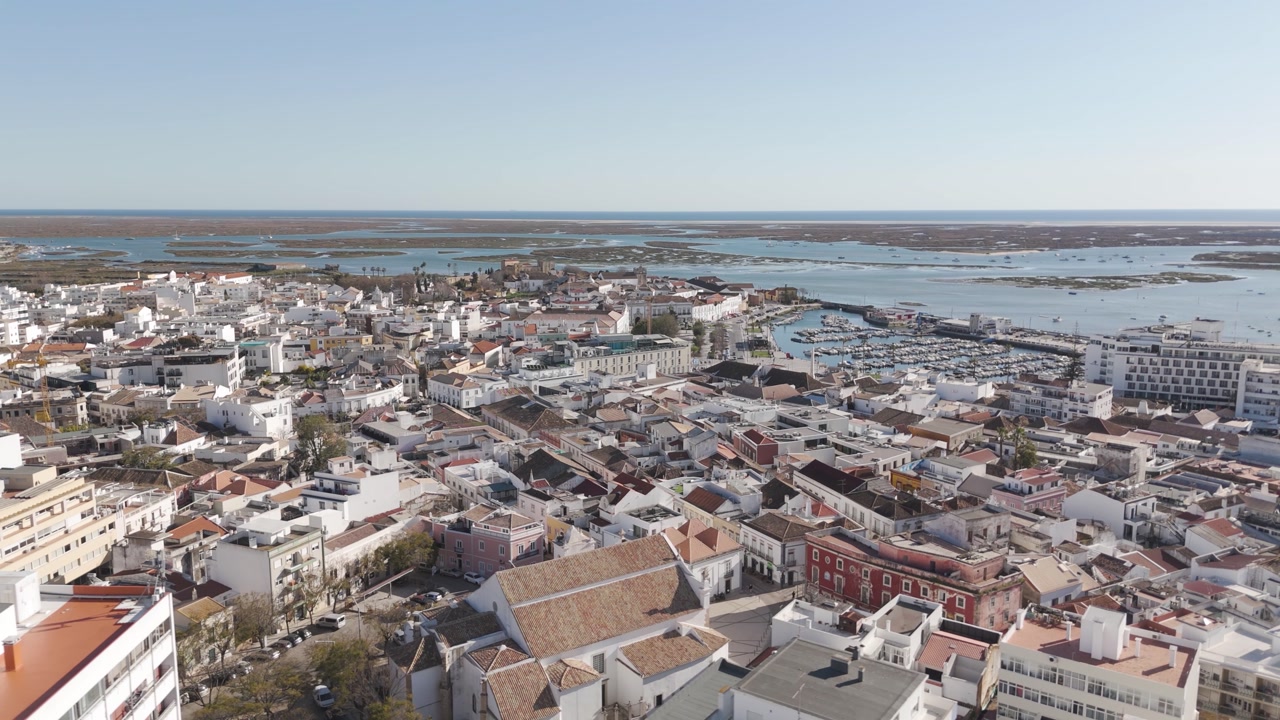 Aerial view of Faro cityscape with the marina visible in the distance.