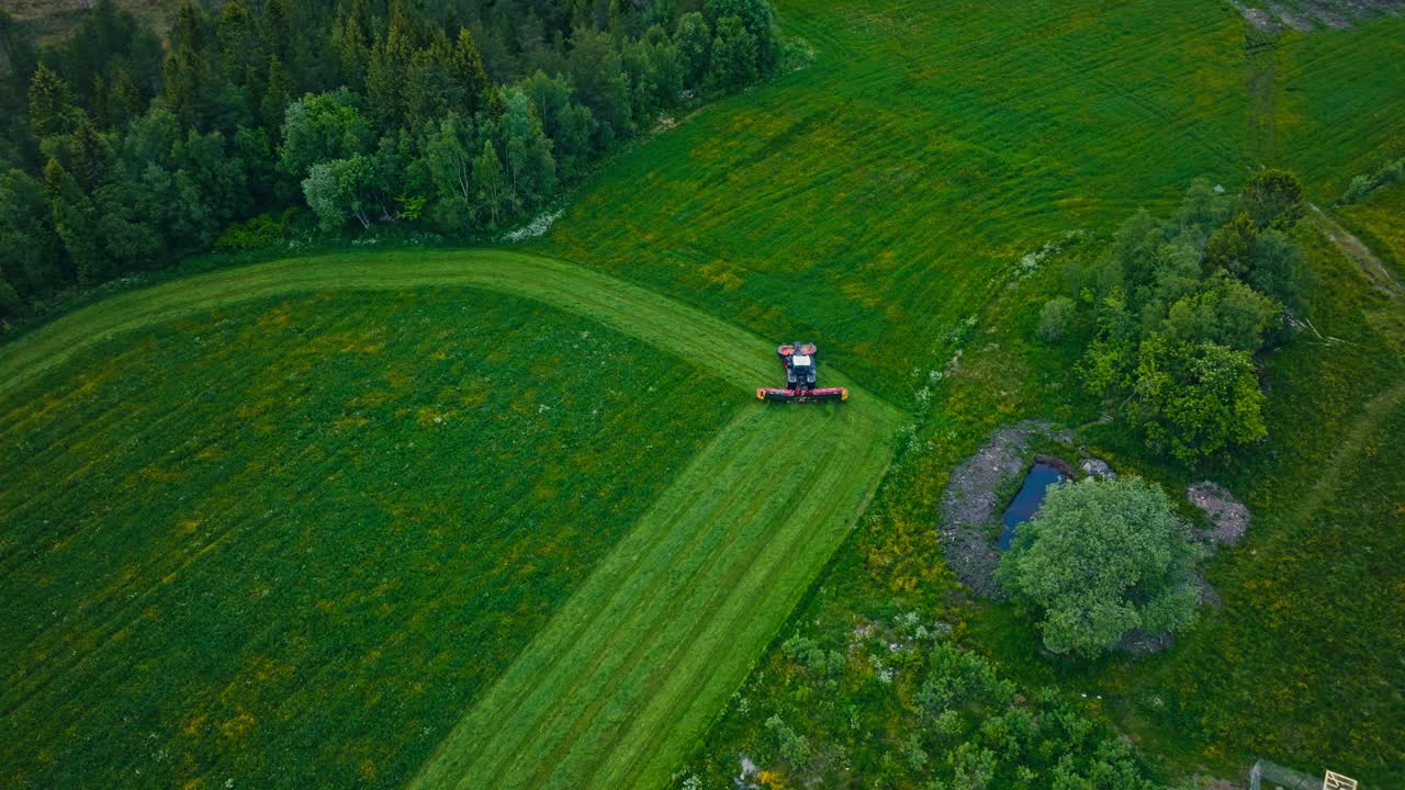 Aerial Shot Of Farm Mower In The Farmland