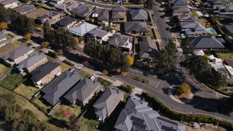 high drone shot of new australian suburb by rivere - large houses on estate