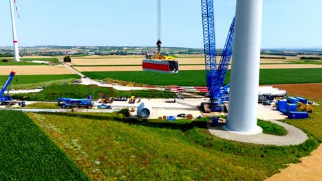 wind turbine construction site in summer - aerial drone shot