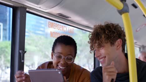 couple using digital tablet while travelling in bus 4k