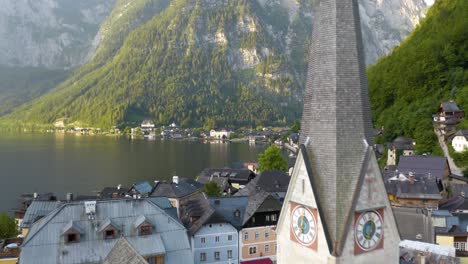 Amazing-Close-Up-Aerial-Shot-of-Church-in-Hallstatt,-Austria