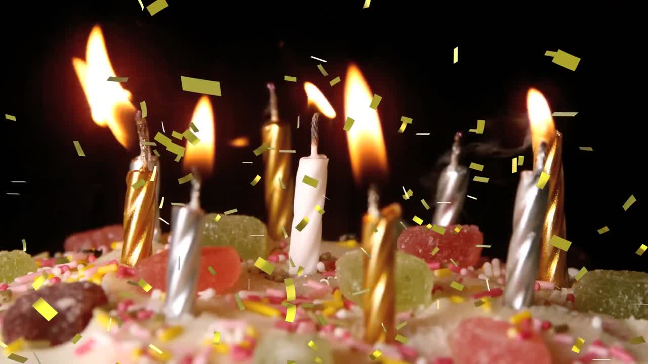 animación de confeti de oro cayendo sobre velas encendidas en el pastel de cumpleaños, apagado