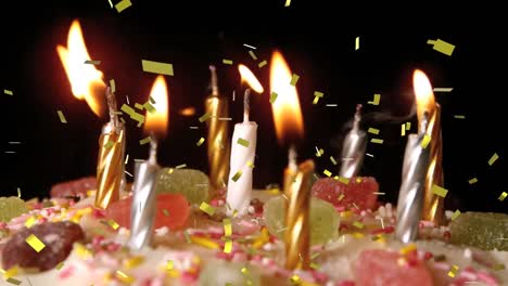 Animation-of-gold-confetti-falling-over-lit-candles-on-birthday-cake,-blown-out