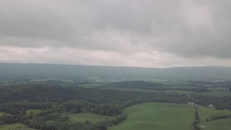 drone flying forward over trees and forest in the smoky mountains in eastern tennessee during a cloudy day