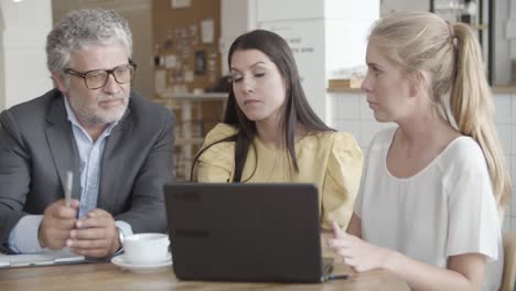 mature man and young woman discussing renovation project