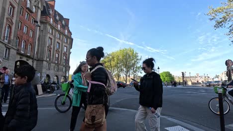 pedestrians crossing busy urban intersection