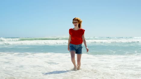 woman having a  fun on beach 4k