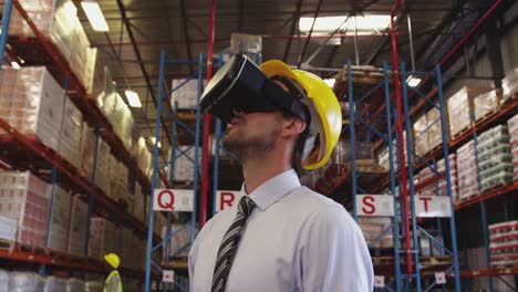 male warehouse manager in vr goggles 4k