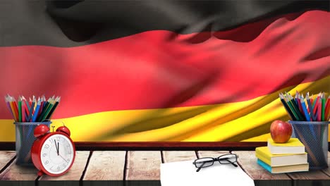 Germany-flag-waving-behind-wooden-table-