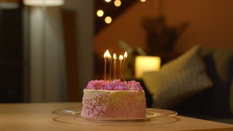 close up of party celebration cake for birthday decorated with icing and candles on table at home 3