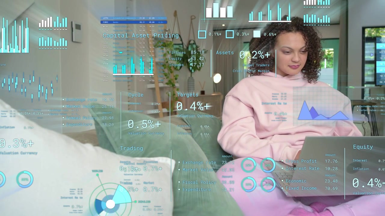 Woman tapping laptop keyboard on sofa, activating finance HUD showing moving charts for remote work
