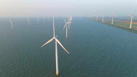 huge windmill turbines, offshore windmill farm in the ocean westermeerwind park , windmills isolated at sea on a beautiful bright day netherlands flevoland noordoostpolder