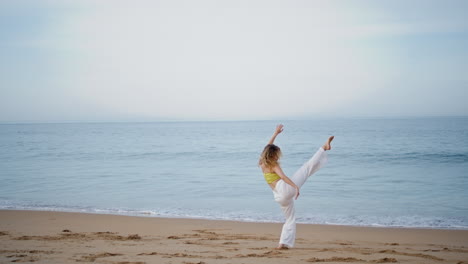 inspired choreographer woman dancing at empty sea coast. girl dancer moving body