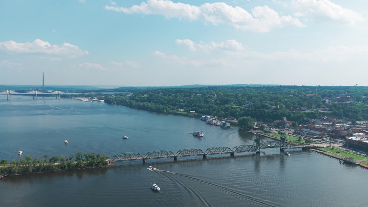 Aerial wide reverse pullback shot of the Stillwater Lift Bridge during summer in Stillwater, Minnesota. 4K