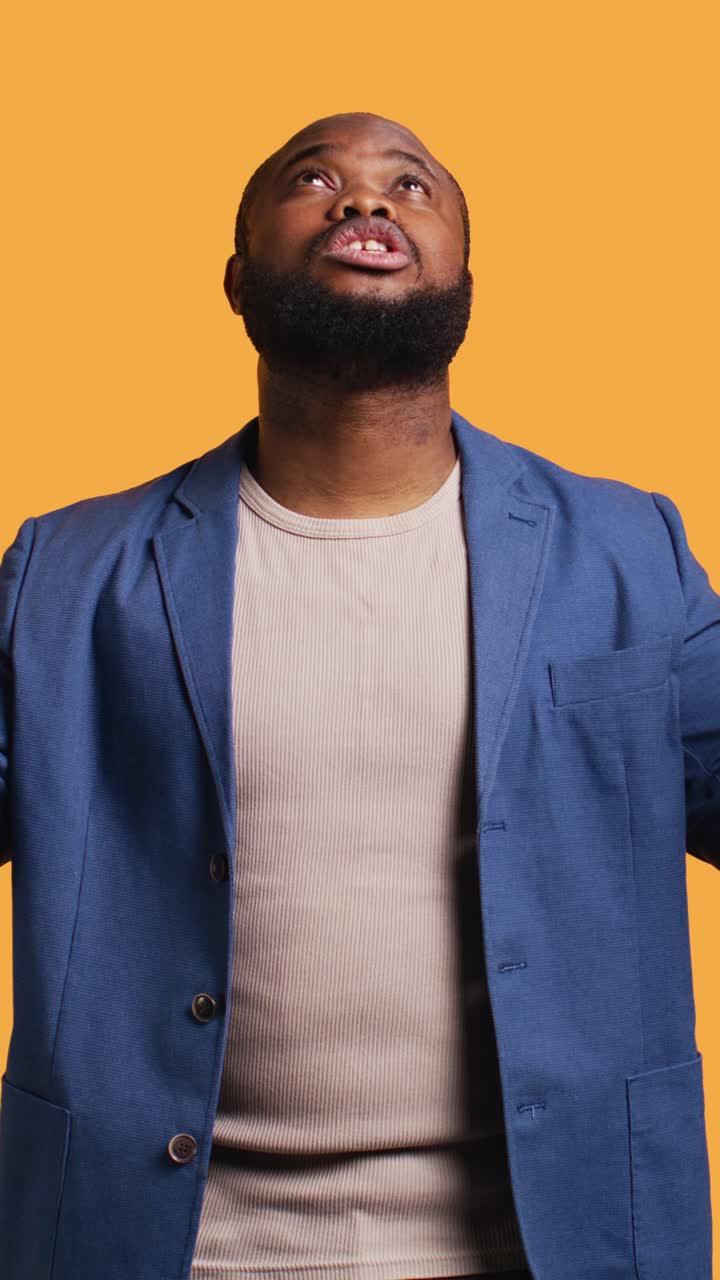 African American Man Looking Up with Awe and Surprise