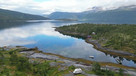 rv camper wild camping at fjord in nordland, norway - aerial 4k