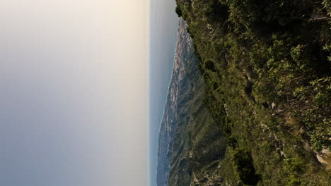 4k vertical shot of beautiful view of marbella by the ocean coast from la concha mountain, marbella, spain