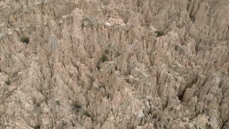 dramatic aerial view of erosion hoodoo formations in la paz, bolivia