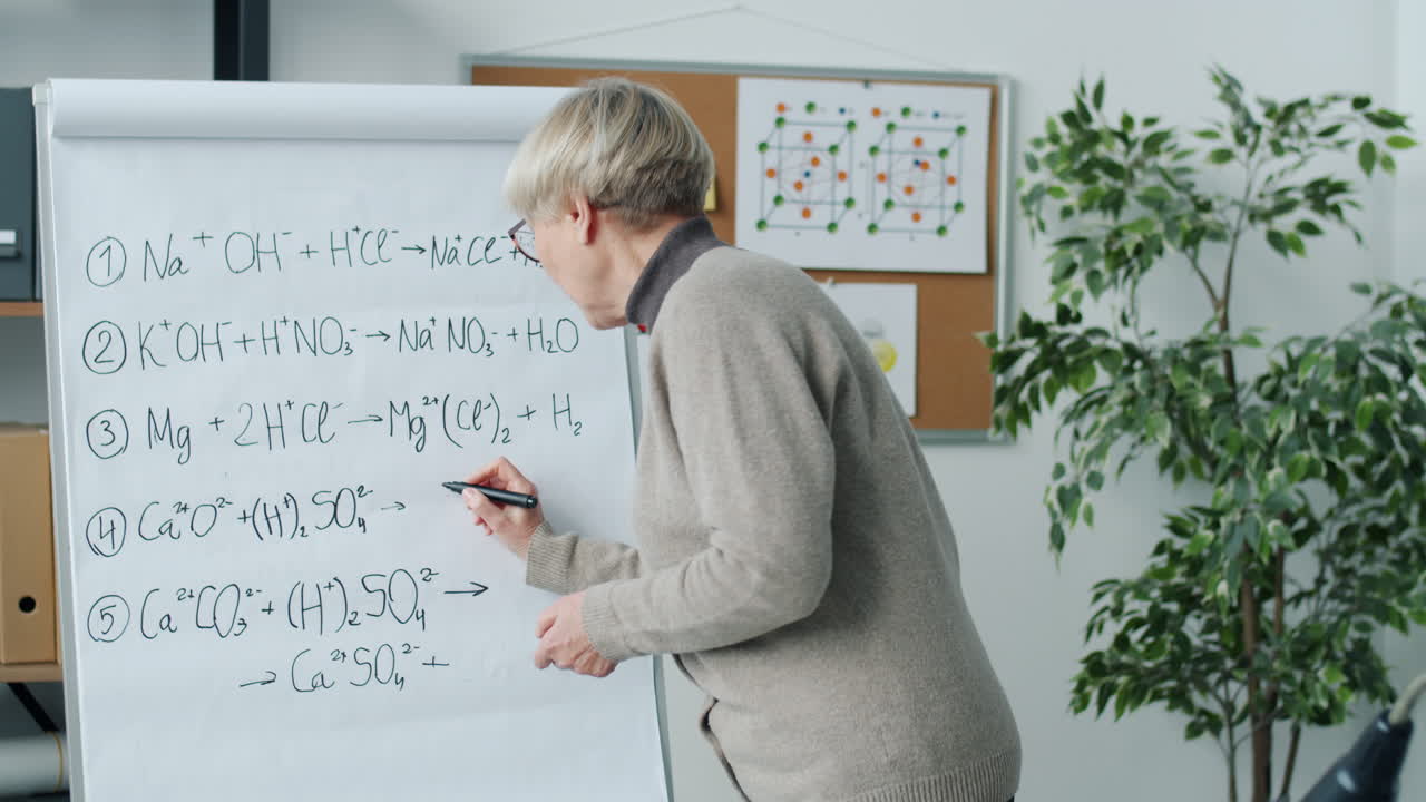 Chemistry Class - Teacher Explaining Formulas on Whiteboard